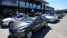 FILE PHOTO: A fleet of Uber's Ford Fusion self driving cars are shown during a demonstration of self-driving automotive technology in Pittsburgh