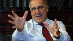 FILE PHOTO - UBI Bank CEO Victor Massiah gestures during an interview with Reuters in downtown Milan July 6, 2012. To match Interview UBI-CEO/ REUTERS/Alessandro Garofalo