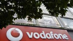 Vodafone branding is seen outside a retail store in London November 12, 2013.   REUTERS/Toby Melville 