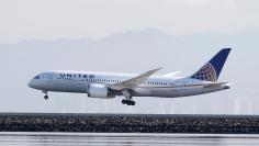 A United Airlines Boeing 787 Dreamliner touches down at San Francisco International Airport, San Francisco, California, in this April 11, 2015, file photo. REUTERS/Louis Nastro/Files  