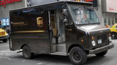 A UPS delivery truck makes its way through Times Square in New York March 5, 2014.
REUTERS/Shannon Stapleton 