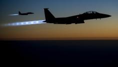 A pair of U.S. Air Force F-15E Strike Eagles fly over northern Iraq