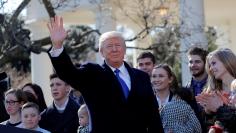 U.S. President Donald Trump waves after addressing the annual March for Life rally, taking place on the National Mall, from the White House Rose Garden in Washington, U.S., January 19, 2018. REUTERS/Carlos Barria