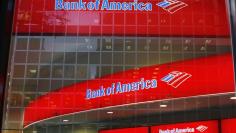 Reflections are seen in the windows of a Bank of America branch in New York