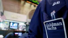 FILE PHOTO:  A trader works at the Goldman Sachs stall on the floor of the New York Stock Exchange, New York, U.S. on April 16, 2012.  REUTERS/Brendan McDermid/File Photo  