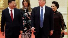 FILE PHOTO: U.S. President Donald Trump and first lady Melania arrive for the state dinner with China's President Xi Jinping and China's first lady Peng Liyuan at the Great Hall of the People in Beijing, China, November 9, 2017. REUTERS/Jonathan Ernst/Fi