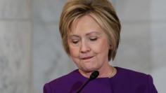 Former Secretary of State Hillary Clinton delivers remarks at a ceremony to unveil a portrait honoring retiring Senate Minority Leader Harry Reid on Capitol Hill in Washington, U.S. December 8, 2016.  REUTERS/Jonathan Ernst