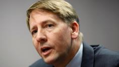 FILE PHOTO:  Richard Cordray answers questions at the Reuters Washington Summit in Washington, DC, U.S. October 23, 2013.   REUTERS/Jonathan Ernst/File Photo