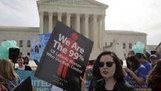 Supporters of contraception rally before Zubik v. Burwell, an appeal brought by Christian groups demanding full exemption from the requirement to provide insurance covering contraception under the Affordable Care Act, is heard by the U.S. Supreme Court i