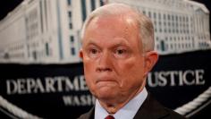 FILE PHOTO: U.S. Attorney General Jeff Sessions looks on during a news conference at the Justice Department in Washington, DC, U.S. on July 20, 2017.   REUTERS/Aaron P. Bernstein/File Photo