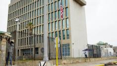 FILE PHOTO: A man works outside of the U.S. Embassy in Havana, Cuba, September 29, 2017. REUTERS/Alexandre Meneghini 