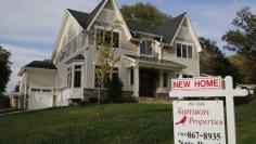 FILE PHOTO: A real estate sign advertising a new home for sale is pictured in Vienna, Virginia, U.S. October 20, 2014.  REUTERS/Larry Downing/File Photo