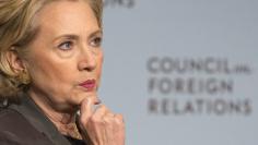 Former U.S. Secretary of State Hillary Clinton reacts while speaking at the Council on Foreign Relations with CFR President Richard Haass in Manhattan, New York