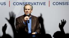 Texas Governor Greg Abbott speaks at a campaign rally for U.S. Republican presidential candidate Ted Cruz in Dallas, Texas February 29, 2016.  REUTERS/Mike Stone 