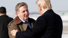 U.S. President Donald Trump greets special election Republican candidate Rick Saccone upon Trump's arrival in Pittsburgh, Pennsylvania, January 18, 2018. REUTERS/Kevin Lamarque