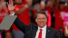 North Carolina Governor Pat McCrory waves before speaking ahead of Republican presidential nominee Donald Trump at a campaign rally in Raleigh, North Carolina November 7, 2016. REUTERS/Chris Keane