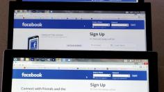 Computer screens display the Facebook sign-in screen in this photo illustration taken in Golden, Colorado July 28, 2015. Facebook, Inc. is to announce its second-quarter earnings July 29, 2015.  REUTERS/Rick Wilking  