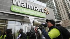 Larry Born, a former Walmart employee from Park Forest, Illinois, takes part in a demonstration for higher wages and better working conditions, outside of a Walmart during Black Friday shopping in Chicago November 28, 2014. REUTERS/Andrew Nelles 