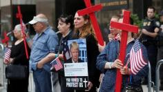 FILE PHOTO: Protesters rally outside the federal court just before a hearing to consider a class-action lawsuit filed on behalf of Iraqi nationals facing deportation, in Detroit, Michigan, U.S., June 21, 2017.   REUTERS/Rebecca Cook/File Photo