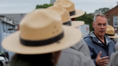 FILE PHOTO: U.S. Interior Secretary Ryan Zinke (C) talks to National Park Service Rangers, while traveling for his National Monuments Review process, in Boston, Massachusetts, U.S., June 16, 2017.  REUTERS/Brian Snyder/File Photo 