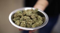 A woman holds marijuana for sale at the MedMen store in West Hollywood