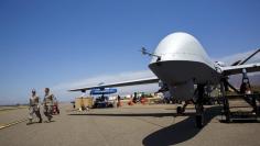 A General Atomics MQ-9 Reaper stands on the runway during "Black Dart", a live-fly, live fire demonstration of 55 unmanned aerial vehicles, or drones, at Naval Base Ventura County Sea Range, Point Mugu, near Oxnard, California July 31, 2015. REUTERS/Patri