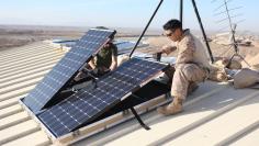 File photo of U.S. soldiers installing solar panels in Afghanistan