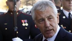 U.S. Secretary of Defense Chuck Hagel walks to the Pentagon in Washington, November 24, 2014. REUTERS/Yuri Gripas