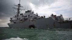 FILE PHOTO: The U.S. Navy guided-missile destroyer USS John S. McCain is seen after a collision, in Singapore waters August 21, 2017. REUTERS/Ahmad Masood/File Photo