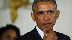 U.S. President Barack Obama pauses while delivering a statement in the East Room of the White House in Washington in this January 5, 2016 file photo. REUTERS/Carlos Barria 