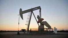 FILE PHOTO: A pump jack operates at a well site leased by Devon Energy Production Company near Guthrie, Oklahoma, U.S., September 15, 2015. REUTERS/Nick Oxford/File Photo