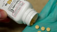 FILE PHOTO: A pharmacist holds prescription painkiller OxyContin at a local pharmacy in Provo