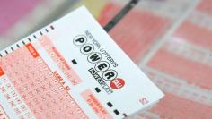 A ticket for the U.S. lottery Powerball sits on a counter in a store on Kenmare Street in Manhattan, New York, U.S., February 22, 2017. REUTERS/Andrew Kelly