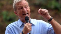 FILE PHOTO: Political and climate activist Tom Steyer speaks while taking part in a protest against U.S. President Donald Trump and Republican congressman Darrell Issa (R-Vista) outside Issa's office in Vista, California, U.S., October 31, 2017. REUTERS/