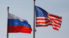 National flags of Russia and the U.S. fly at Vnukovo International Airport in Moscow, Russia April 11, 2017.  REUTERS/Maxim Shemetov