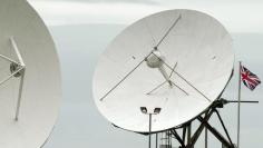 FILE PHOTO - Satellite dishes are seen at GCHQ's outpost at Bude, close to where trans-Atlantic fibre-optic cables come ashore in Cornwall, southwest England