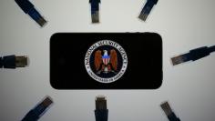 An illustration picture shows the logo of the U.S. National Security Agency on the display of an iPhone in Berlin