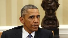 U.S. President Barack Obama talks to the media in the Oval Office in Washington about shootings at military facilities in Chattanooga
