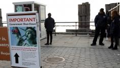 A sign announcing the closure of the Statue of Liberty, due to the U.S. government shutdown, sits near the ferry dock to the Statue of Liberty at Battery Park in Manhattan