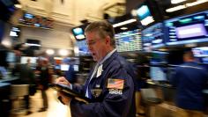 Traders work on the floor of the New York Stock Exchange (NYSE) in New York City, U.S., July 11, 2016.  REUTERS/Brendan McDermid