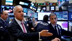 Traders work on the floor of the New York Stock Exchange (NYSE) in New York, U.S., May 15, 2017. REUTERS/Brendan McDermid