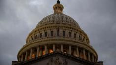 FILE PHOTO: The U.S. Capitol building is lit at dusk ahead of planned votes on tax reform in Washington, U.S., December 18, 2017.   REUTERS/Joshua Roberts/File Photo