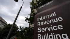 FILE PHOTO: A security camera hangs near a corner of the U.S. Internal Revenue Service (IRS) building in Washington May 27, 2015.  REUTERS/Jonathan Ernst