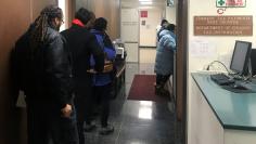 Residents line up to pre-pay the assessed portion of their 2018 state and local tax bill at New Rochelle City Hall in New Rochelle