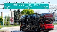 FILE PHOTO - A car hauler heading for Detroit, Michigan, drives on the lane to Ambassador Bridge in Windsor, Ontario, Canada on April 28, 2017. REUTERS/Rebecca Cook/File Photo