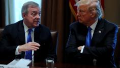 U.S. President Donald Trump, flanked by U.S. Senator Dick Durbin (D-IL), listens during a bipartisan meeting with legislators on immigration reform at the White House in Washington, U.S. January 9, 2018. REUTERS/Jonathan Ernst/Files