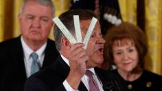 U.S. House Committee on Transportation and Infrastructure Chairman Representative Bill Shuster (R-PA) holds strips of paper used by air traffic controllers to keep track of planes during an event where U.S. President Donald Trump proposed reforms to the 