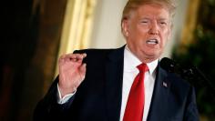 U.S. President Donald Trump speaks before awarding the Medal of Honor to Vietnam War Veteran, retired Army Capt. Gary Rose, during a ceremony in the East Room of the White House in Washington, U.S., October 23, 2017.   REUTERS/Joshua Roberts