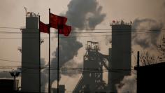 FILE PHOTO: Chinese national flags are flying near a steel factory in Wu'an, Hebei province, China, February 23, 2017.  REUTERS/Thomas Peter/File Photo