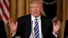 FILE PHOTO: U.S. President Donald Trump attends a meeting with U.S. House Deputy Whip team at the  East room of the White House in Washington, U.S. March 7, 2017. REUTERS/Carlos Barria/File Photo